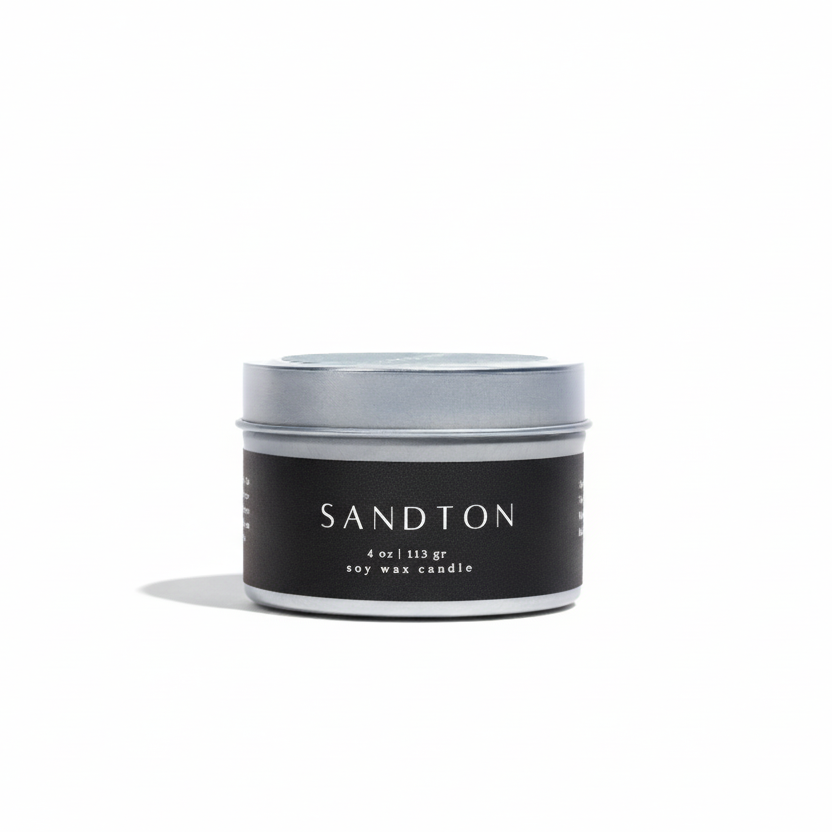 Candle jar with 'Sandton' branding on a white background