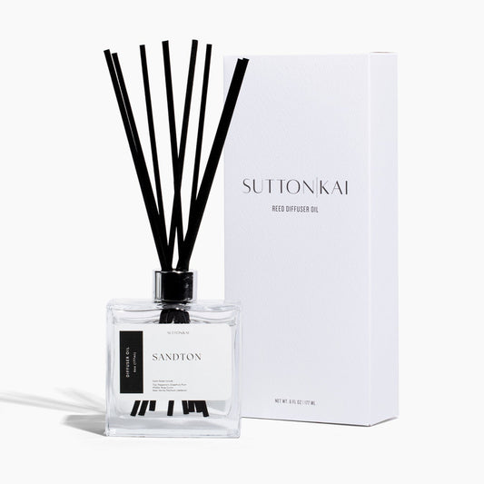 Sutton Kai diffuser bottle with black reeds and packaging on a white background