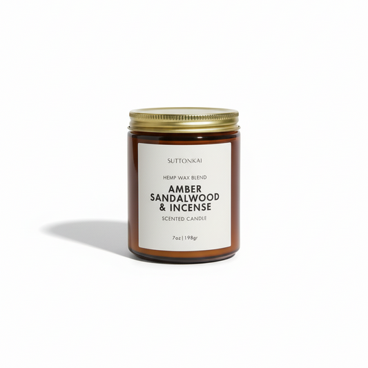 Scented candle jar labeled 'Amber Sandalwood & Incense' on a white background
