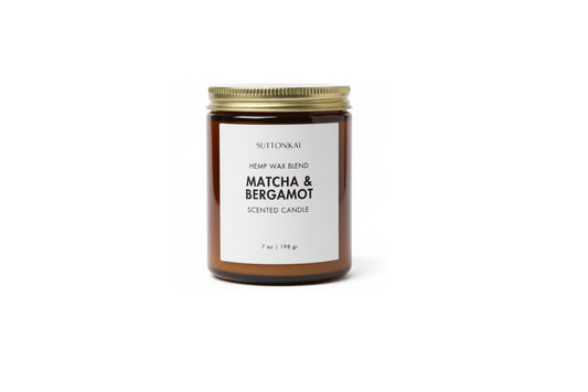 Candle jar labeled 'Matcha & Bergamot' on a white background