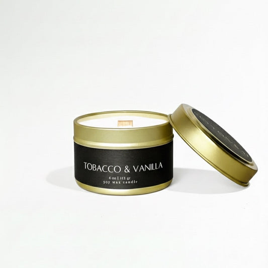 Tobacco & Vanilla candle in a black container with gold lid on a white background