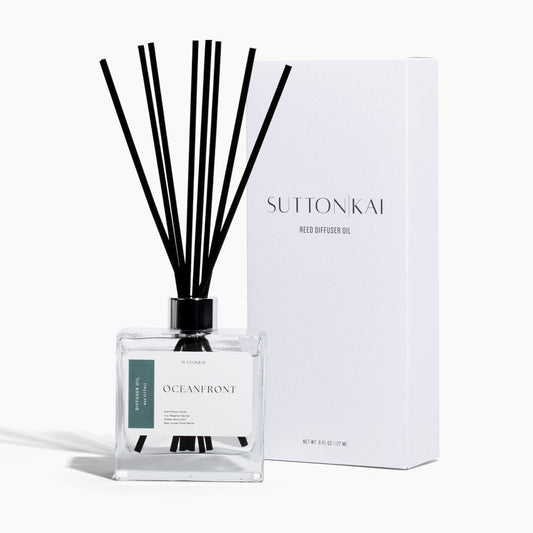 Sutton Kai diffuser with black sticks and packaging on a white background